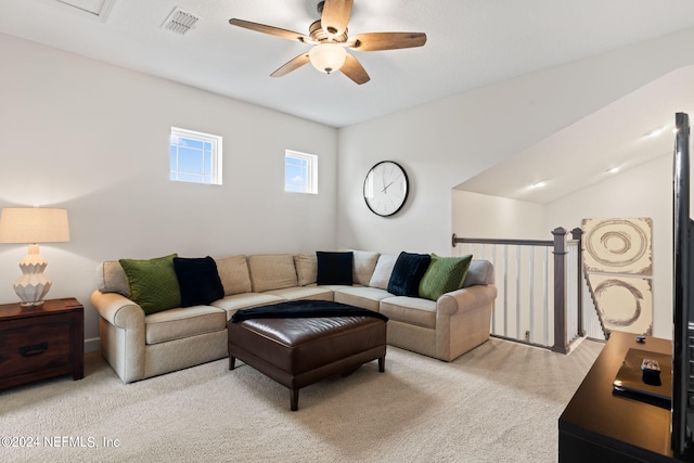 living room with ceiling fan and light colored carpet