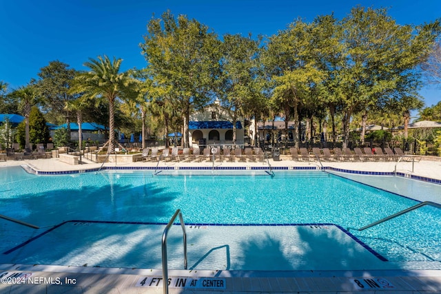 view of swimming pool featuring a patio