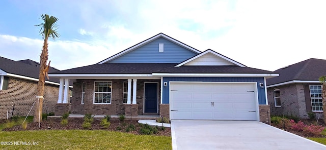 view of front of home featuring a garage, covered porch, concrete driveway, and brick siding