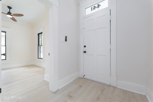 entryway featuring light wood-type flooring and ceiling fan