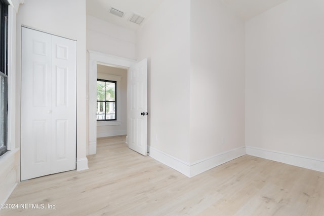 spare room with light wood-type flooring