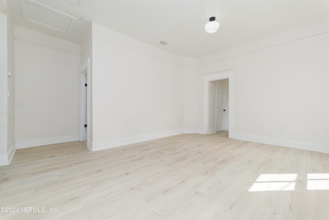 unfurnished room with light wood-type flooring