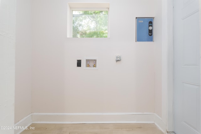 laundry area with washer hookup, light hardwood / wood-style flooring, and electric dryer hookup