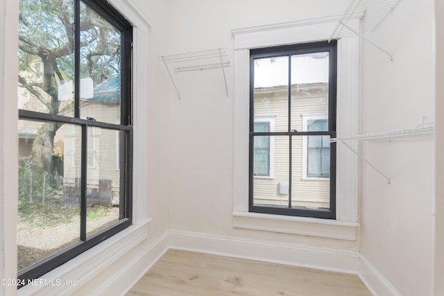 spacious closet featuring hardwood / wood-style floors