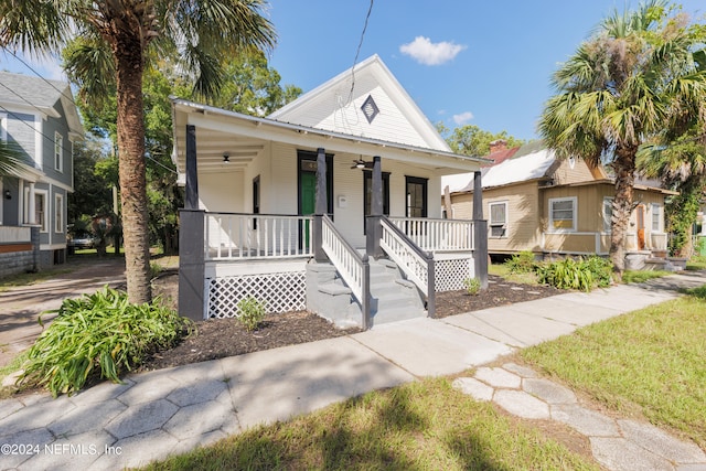 bungalow featuring a porch and ceiling fan