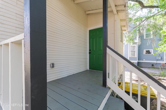 property entrance featuring a deck