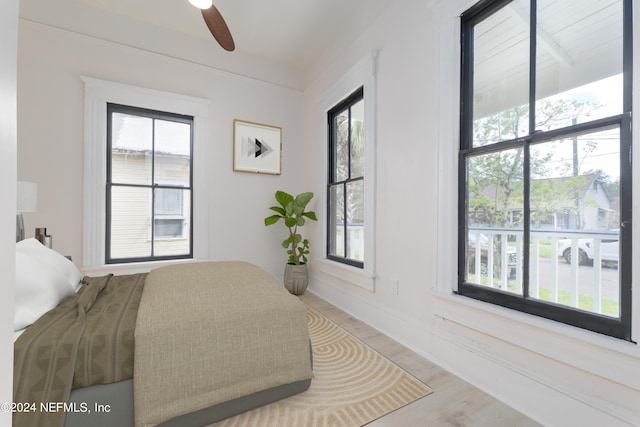 bedroom featuring hardwood / wood-style floors and ceiling fan