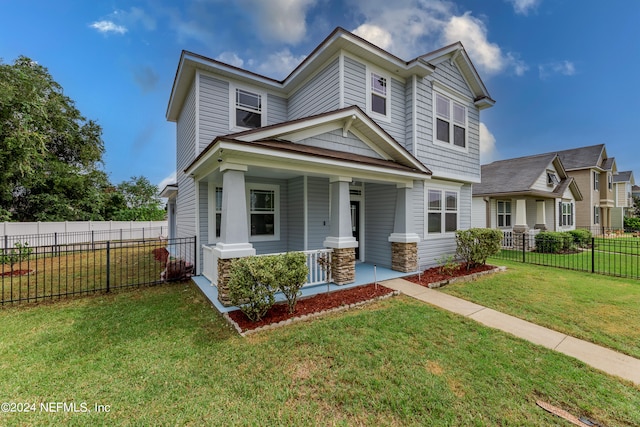 view of front of property with a front lawn and covered porch