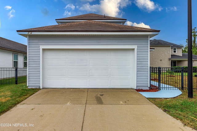 garage featuring a yard