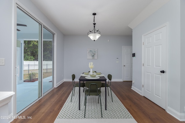 dining space featuring dark hardwood / wood-style floors