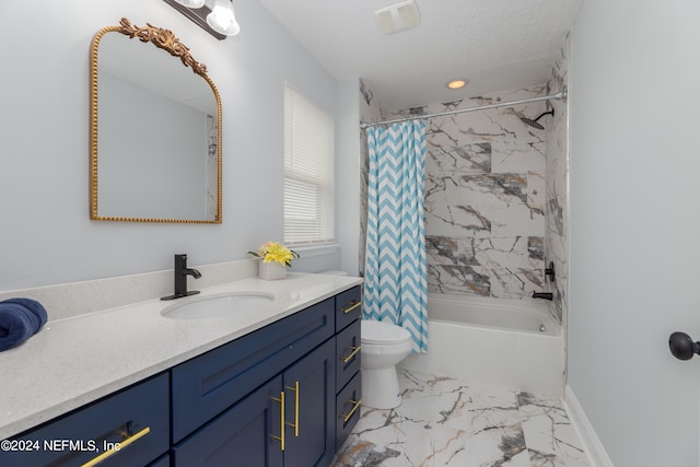 full bathroom featuring shower / bath combo, vanity, and toilet