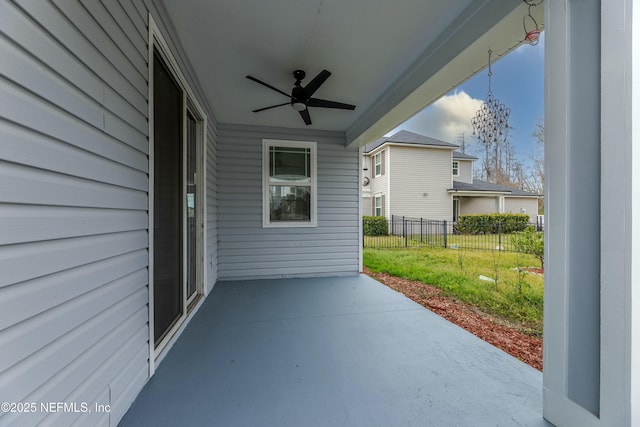 view of patio featuring a ceiling fan and fence