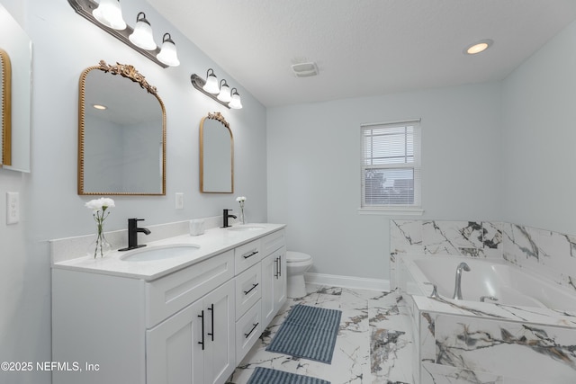 bathroom with double vanity, baseboards, a bath, marble finish floor, and a sink