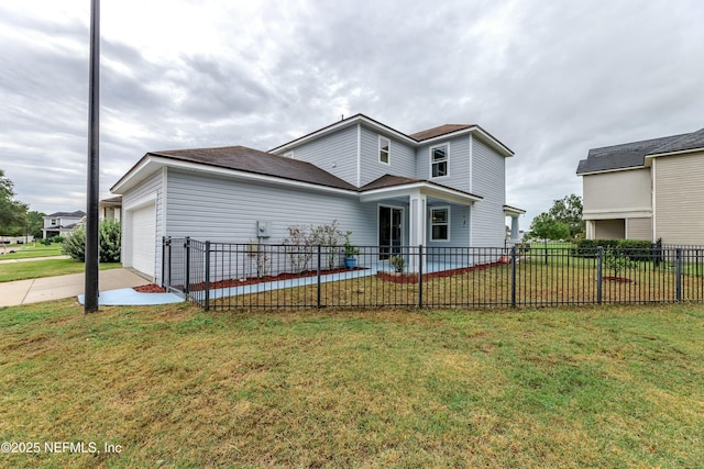 traditional home with a garage, fence, concrete driveway, and a front yard