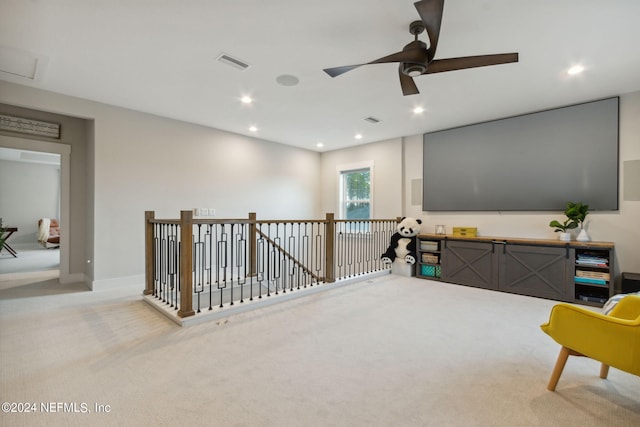 living area with light colored carpet