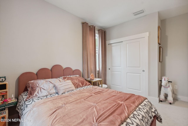 bedroom with carpet floors and a closet