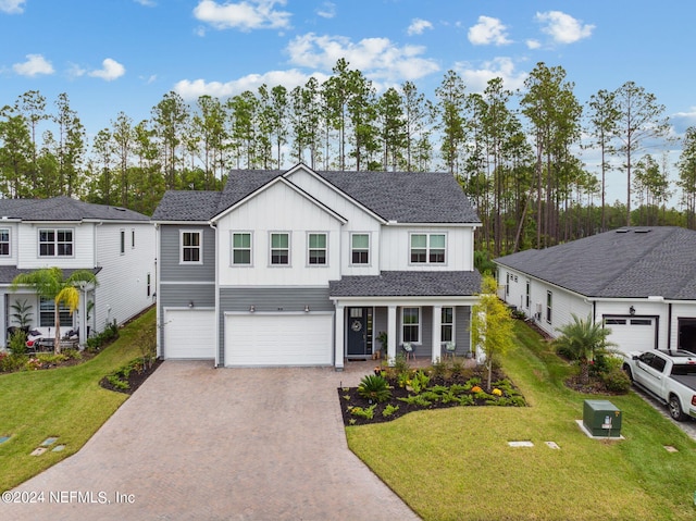 view of front facade featuring a front yard and a garage