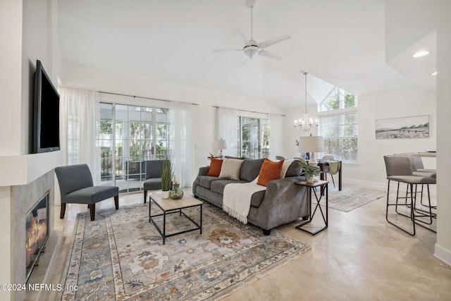 living room featuring ceiling fan with notable chandelier and high vaulted ceiling