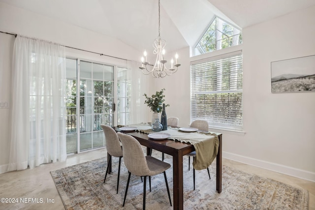 dining space with lofted ceiling and a chandelier