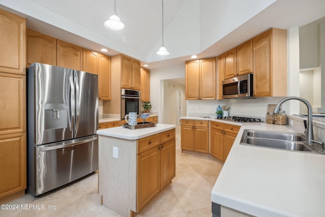 kitchen with hanging light fixtures, light tile patterned floors, sink, a kitchen island, and appliances with stainless steel finishes