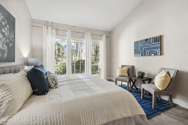 bedroom featuring carpet floors, access to outside, and lofted ceiling