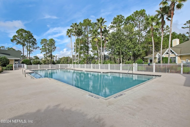 view of swimming pool with a patio area