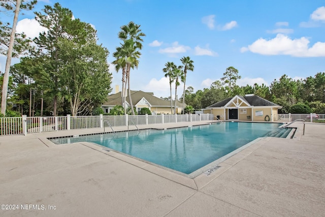 view of pool featuring a patio area