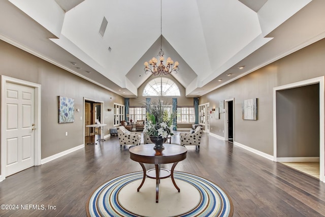 interior space featuring a notable chandelier, dark wood-type flooring, and high vaulted ceiling