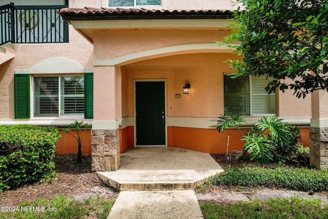 doorway to property featuring a balcony