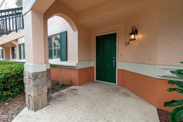 doorway to property featuring a balcony