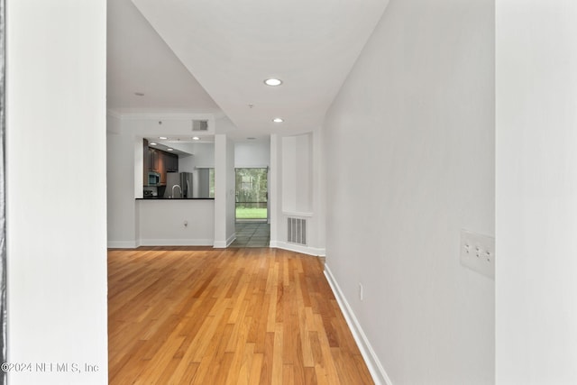 unfurnished living room with light wood-type flooring