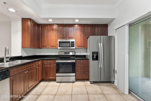 kitchen featuring appliances with stainless steel finishes, crown molding, light tile patterned flooring, and sink