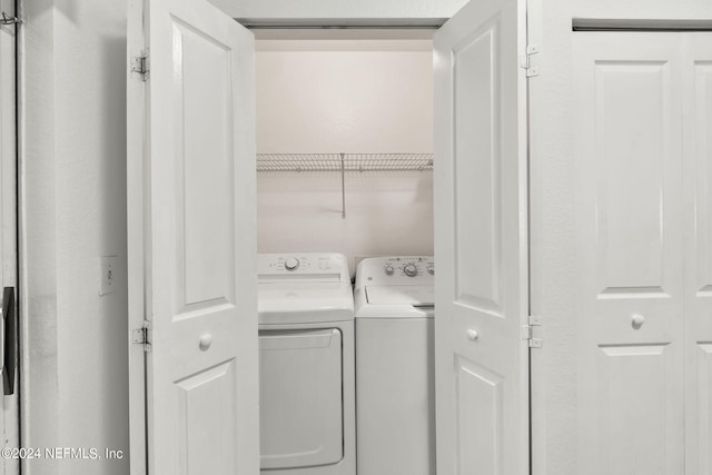 washroom with washer and dryer