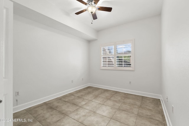 unfurnished room with light tile patterned floors and ceiling fan