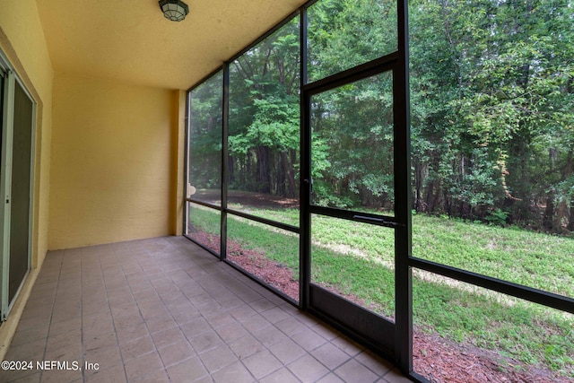 unfurnished sunroom with a healthy amount of sunlight