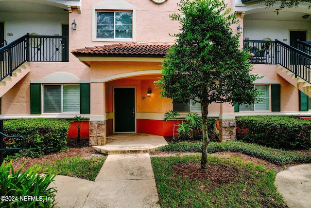 doorway to property with a balcony