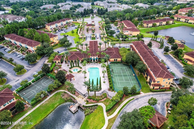 birds eye view of property with a water view