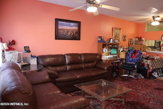 carpeted living room featuring ceiling fan