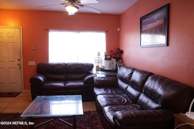 tiled living room with ceiling fan