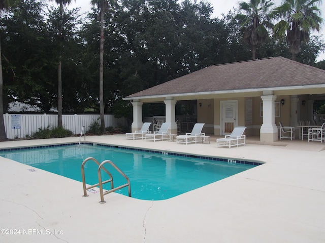 view of swimming pool with a patio