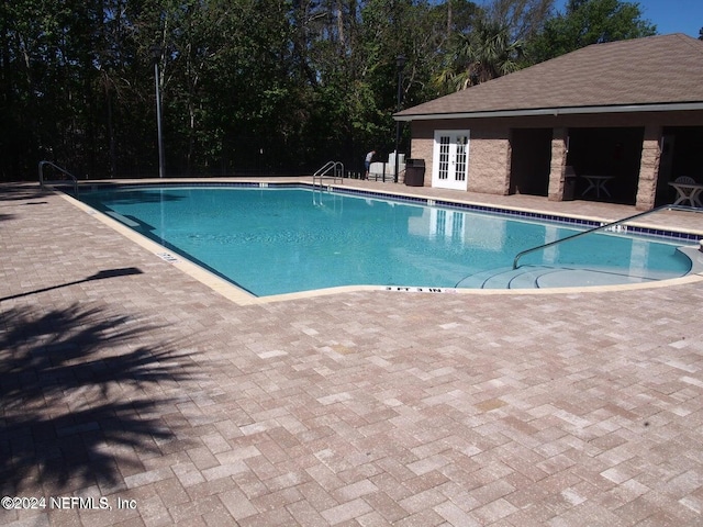 view of swimming pool featuring a patio