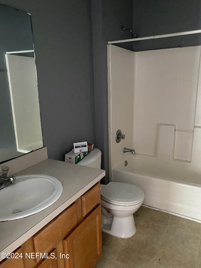 full bathroom with vanity, toilet, and shower / washtub combination