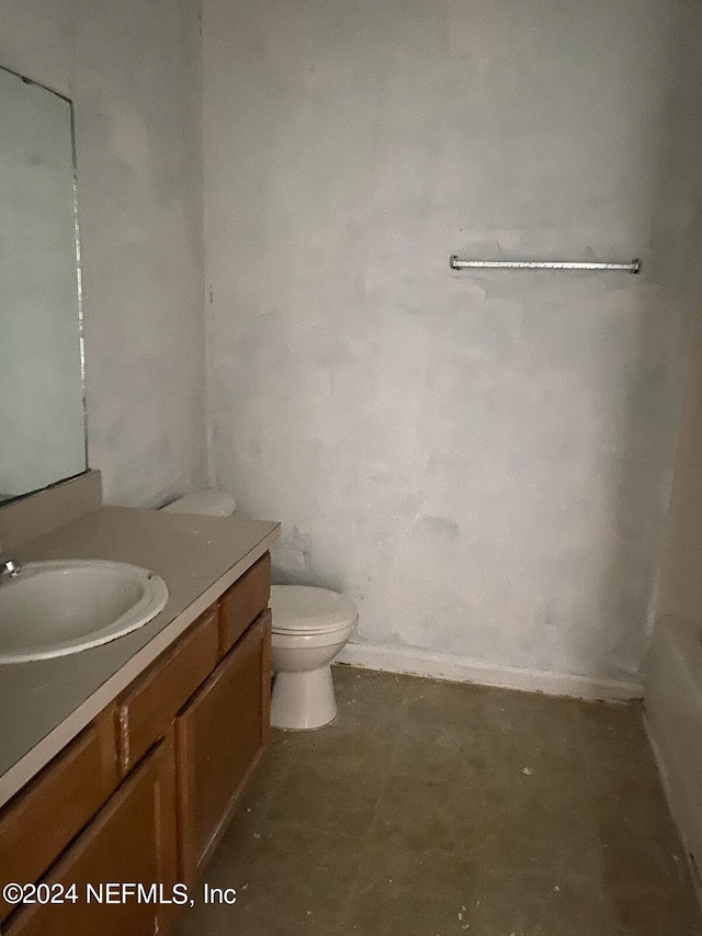 bathroom with toilet and vanity