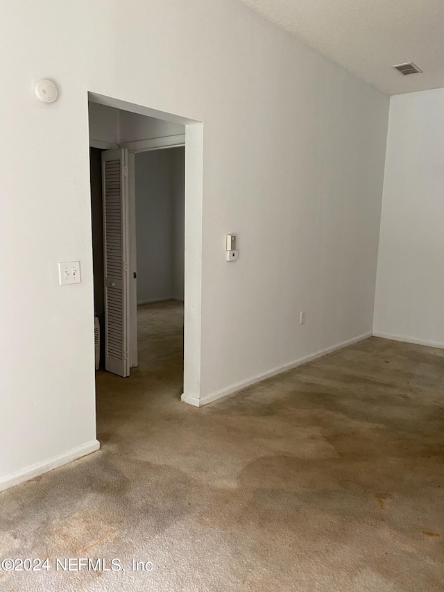 spare room featuring carpet flooring