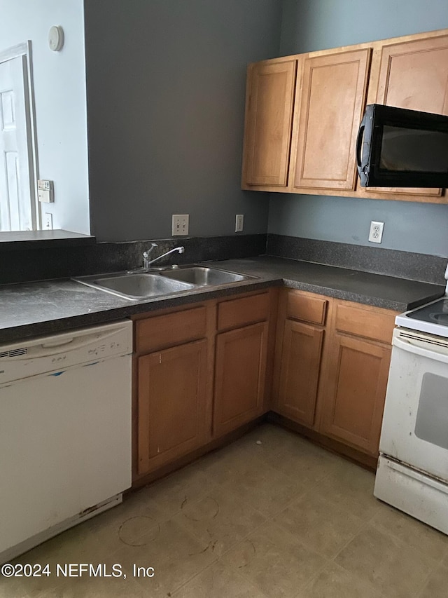 kitchen featuring sink and white appliances