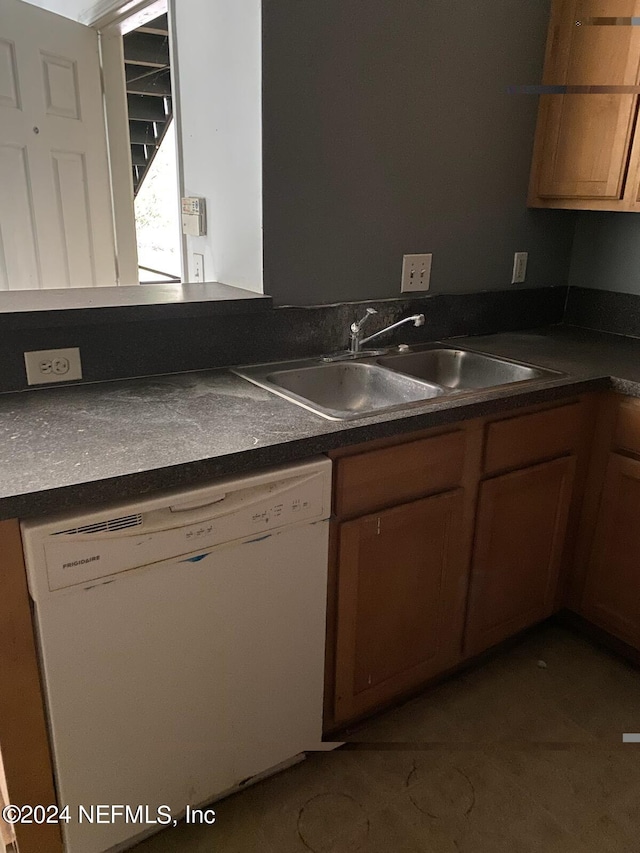 kitchen featuring dishwasher and sink