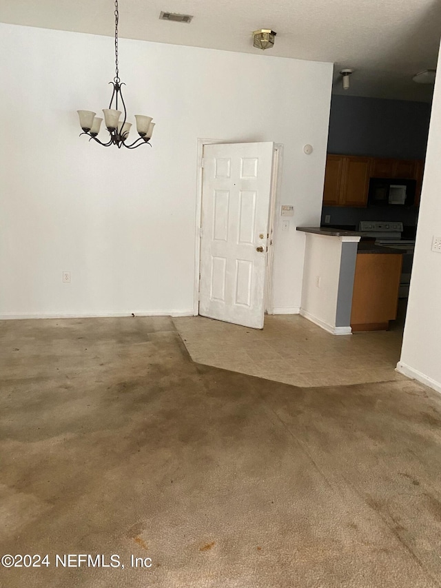 unfurnished dining area with a notable chandelier