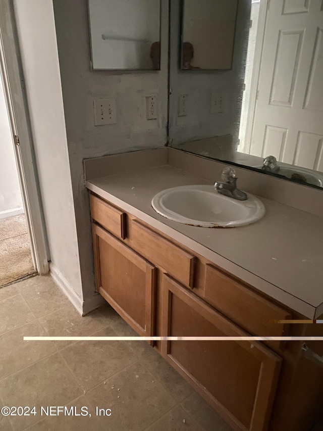 bathroom with vanity and tile patterned floors