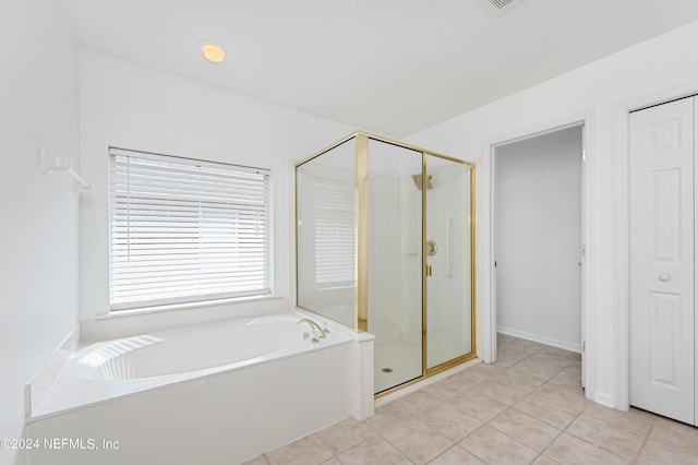 bathroom featuring tile patterned floors and plus walk in shower