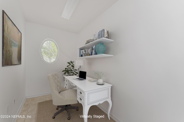 office area with light tile patterned floors